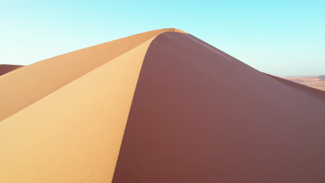 Aerial-View-Of-Orange-Sand-Dunes-In-Djanet-Desert-In-Algeria---drone-shot