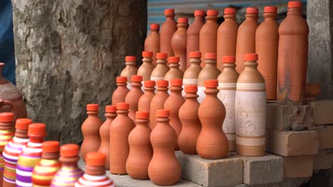 After-making-beautiful-things-out-of-clay-and-even-water-bottles,-they-are-being-sold-in-the-market
