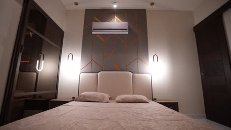 Futuristic-style-bedroom-with-metallic-decor,-interior-drone-shot