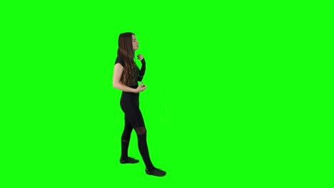 Attractive-young-female-acting-a-fight-scene-in-front-of-a-green-screen