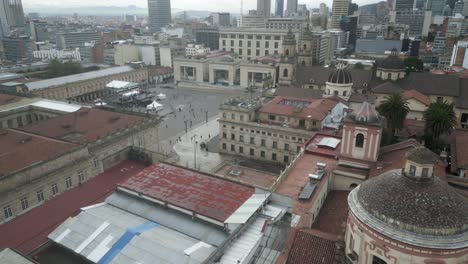 Aerial-View-of-Bogota-Colombia-HIstoric-Downtown,-Cathedral,-City-Hall,-Palace-of-Justice-and-People-on-Bolivar-Square
