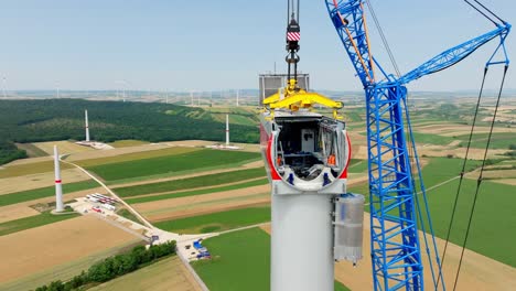 Close-Up-Of-Windmill-Head-Under-Construction---aerial-drone-shot