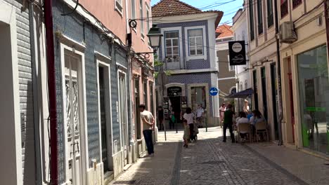 Wide-shot-showing-tourist-visiting-City-of-Aveiro-in-Portugal-with-old-buildings-during-sunny-day