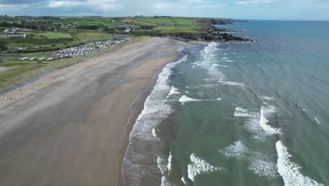 Flight-along-Bunmahon-Beach-Copper-Coast-Ireland-on-a-blustery-summer-day-with-heavy-showers-at-times