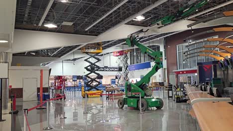 Cherry-picker-and-scissor-lifts-allow-construction-workers-to-reach-ceiling-in-Atlanta-Hartsfield-Jackson-International-Airport-near-South-security-checkpoint