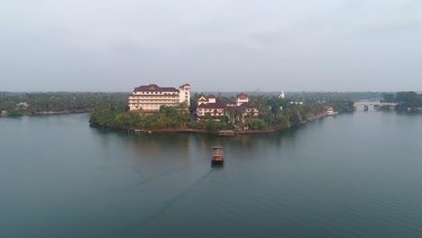 Drone-footage-of-Lake-with-a-hotel-in-the-centre-of-the-lake