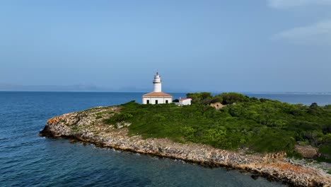 Drone-flying-straight-to-lighthouse-on-small-island