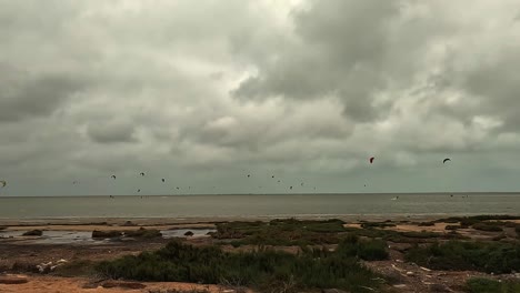 Kite-surfers-practicing-kitesurf-on-Djerba-island-in-Tunisia-on-cloudy-day
