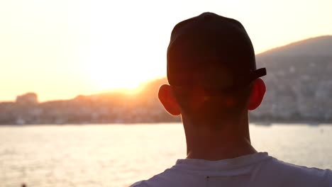 Saranda,-man-watching-the-beautiful-sunset-over-the-sea