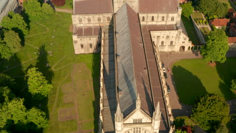 Pan-up-aerial-reveal-shot-of-Winchester-Cathedral-Facade