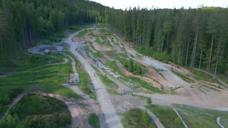 Drone-shot-bike-park-and-trails-in-mountains-of-Sweden-in-summer-sun
