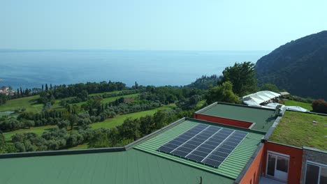 Aerial-Flying-Over-Rooftops-Covered-In-Grass-And-Solar-Panels-At-Golf-Ca-'Degli-Ulivi-Located-In-Marciaga,-Italy