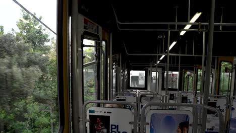 Inside-View-Of-Funicular-Travelling-Past-Trees-In-Naples