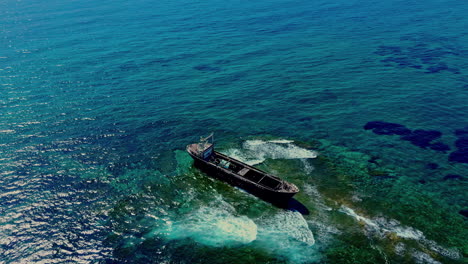 Cinematic-aerial-footage-of-a-shipwreck-close-to-Venus-Beach-in-Cyprus,-Europe,-Drone