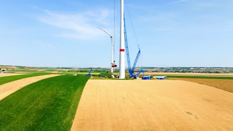 Wind-Farm-Under-Construction-During-Summer---drone-shot
