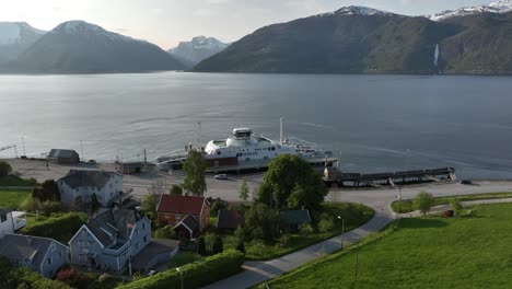 Ferry-Dragsvik-loading-cars-at-Sognefjord-with-mountains-and-fjord-background-during-sunset---Norway