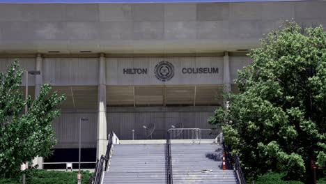 Hilton-Coliseum-on-the-campus-of-Iowa-State-University-in-Ames,-Iowa-with-close-up-of-sign-stable-video