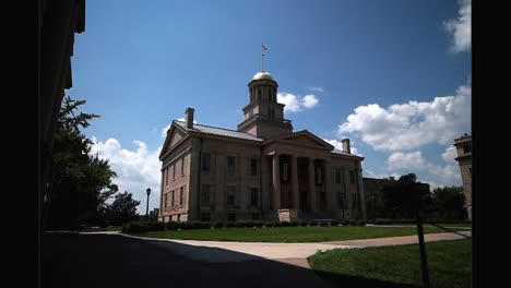 Old-Capitol-building-on-the-campus-of-the-University-of-Iowa-in-Iowa-City,-Iowa-with-stable-video-under-trees-at-an-angle