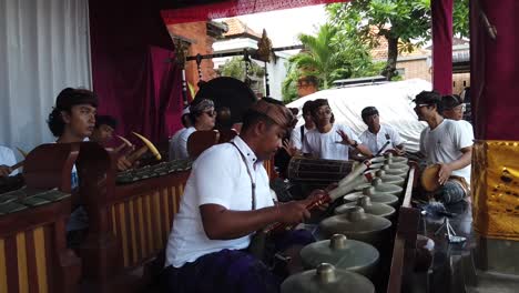 Balinese-Orchestra-Plays-Gamelan-Gong-Kebyar-at-Bali-Hindu-Temple-Ceremony,-Art-and-Culture-of-Indonesia,-Percussion-Gongs