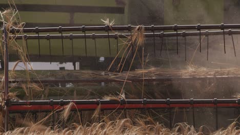Combine-Harvester-Mowing-Wheat-Field:-Slow-Mo-Close-Up