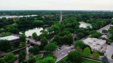 Phenomenal-aerial-Naperville-Illinois---Centennial-Beach-in-the-summer-and-Millennium-Carillon,-Rotary-Park-Sled-Hill,-Moser-Tower,-Naperville-Riverwalk-in-DuPage-County