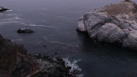 Aerial-shot-pushing-towards-rocks-off-the-coast-of-Big-Sur,-California