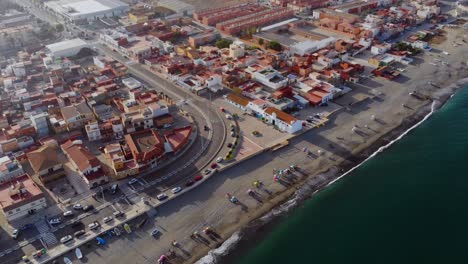 Drone-footage-following-the-beach-in-Linea-De-La-Concepcion,-Spain