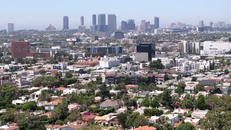 Aerial-View-of-West-Hollywood-With-Century-City-Buildings-in-Misty-Skyline