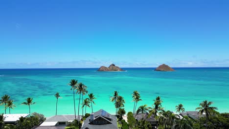 Drone-shot:-Lanikai-shoreline-towards-Na-Mokolua-Islands,-Oahu,-HI