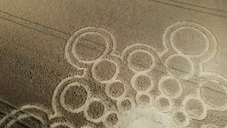 Sunlit-aerial-view-looking-down-over-Beauworth-2023-crop-circle-atomic-pattern-on-Hampshire-wheat-field-farmland