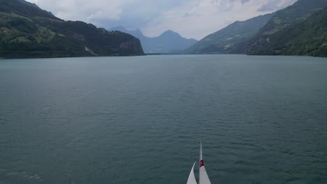 Aerial-view-captures-vastness-of-Walensee-lake-with-yacht-sailing-in-waters