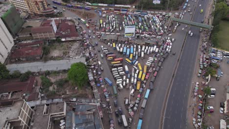 Aerial-drone-footage-of-Ngara-matatu-bus-stop-in-Nairobi,-Kenya