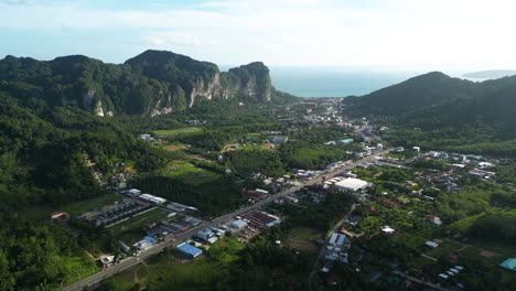 Aerial-of-Ao-Nang,-Thailand,-nested-between-mountains-and-vast-ocean