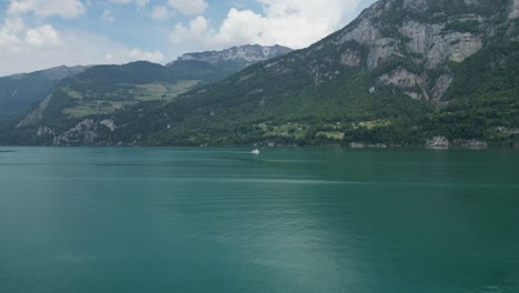 Mountainous-landscape-of-rocky-Swiss-Alps-adorned-with-tranquil-lake