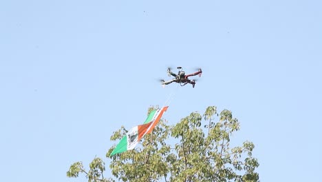 An-Indian-tricolor-flag-kite-is-being-flown-high-in-the-sky-by-being-attached-to-an-aerial-drone-camera-at-the-International-Kite-Festival