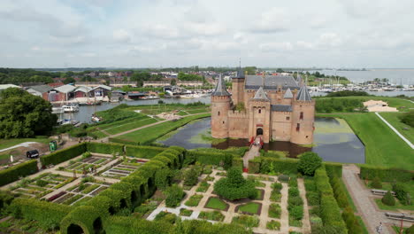 Muiderslot-castle:-aerial-view-in-orbit-close-to-the-beautiful-castle-and-where-you-can-see-the-port-and-the-channels-that-surround-it