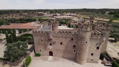 Aerial-view-orbiting-the-castle-of-Arguijuelas-de-Abajo-military-stronghold-in-the-city-of-Cáceres,-Spain