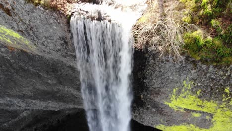 Overhead-pan-of-a-waterfall-in-nature