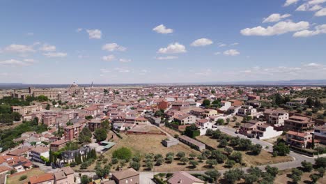 Aerial-view-flying-across-the-residential-district-of-Oropesa,-Spanish-town-in-the-province-of-Toledo