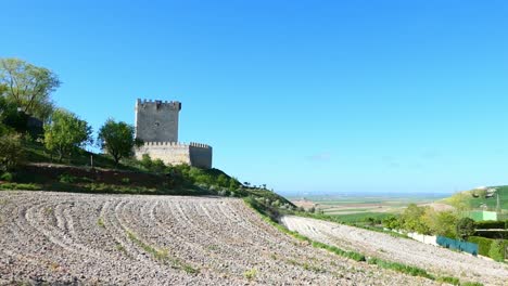 Spanish-castle-on-a-hill-looking-over-a-plain