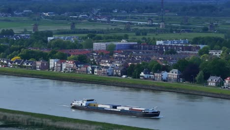 Aerial-View-Of-Container-Boat-Passing-Through-Kinderdijk