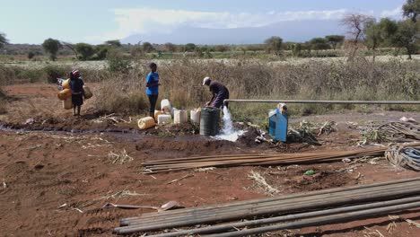 Masai-people-collecting-freshwater-from-borehole.-Kenya,-Africa