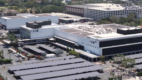 CBS-Television-City-Studios-Buildings-in-Fairfax-on-Hot-Sunny-Day,-Drone-Shot,-Los-Angeles-CA-USA,-Aerial-View