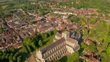 Slow-aerial-shot-over-Winchester-Cathedral-towards-town-centre