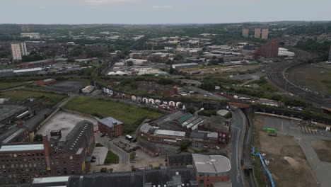 Establishing-Aerial-Drone-Shot-Flying-Over-Edge-of-Leeds-City-Centre-towards-Holbeck