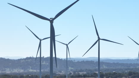 Close-Up-Telephoto-Drone-View-Of-Wind-Turbines-Rotating-In-Breeze,-Australia-4K