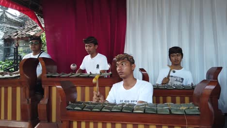 Gamelan-Orchestra-Play-Traditional-Balinese-Percussion-Music-at-Wedding-Ceremony-Bali-Indonesia,-Intricate-Musical-Rhythms