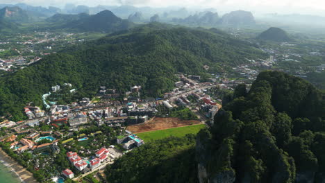 Aerial-of-Ao-Nang,-climbing-capital-of-Thailand,-between-limestone-cliffs