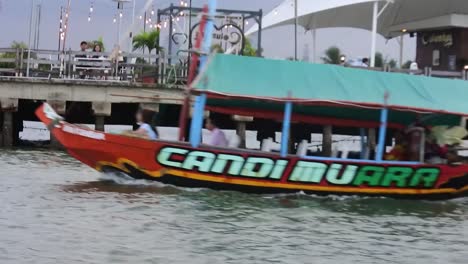 Boats-cruise-in-the-waters-of-Ancol-beach,-North-Jakarta,-Indonesia