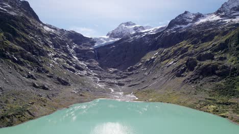 Aerial-Flyover-of-Turquoise-Trift-Lake-and-Glacier-View